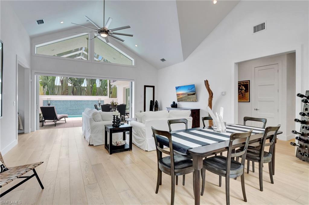 2120 Curtis Street Naples, FL 34112 - Photo 14 of 38 a view of a dining room with furniture window and wooden floor