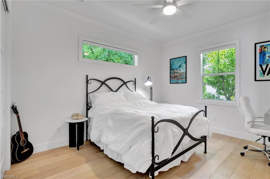 2120 Curtis Street Naples, FL 34112 - Photo 18 of 38 a bedroom with a bed and a window