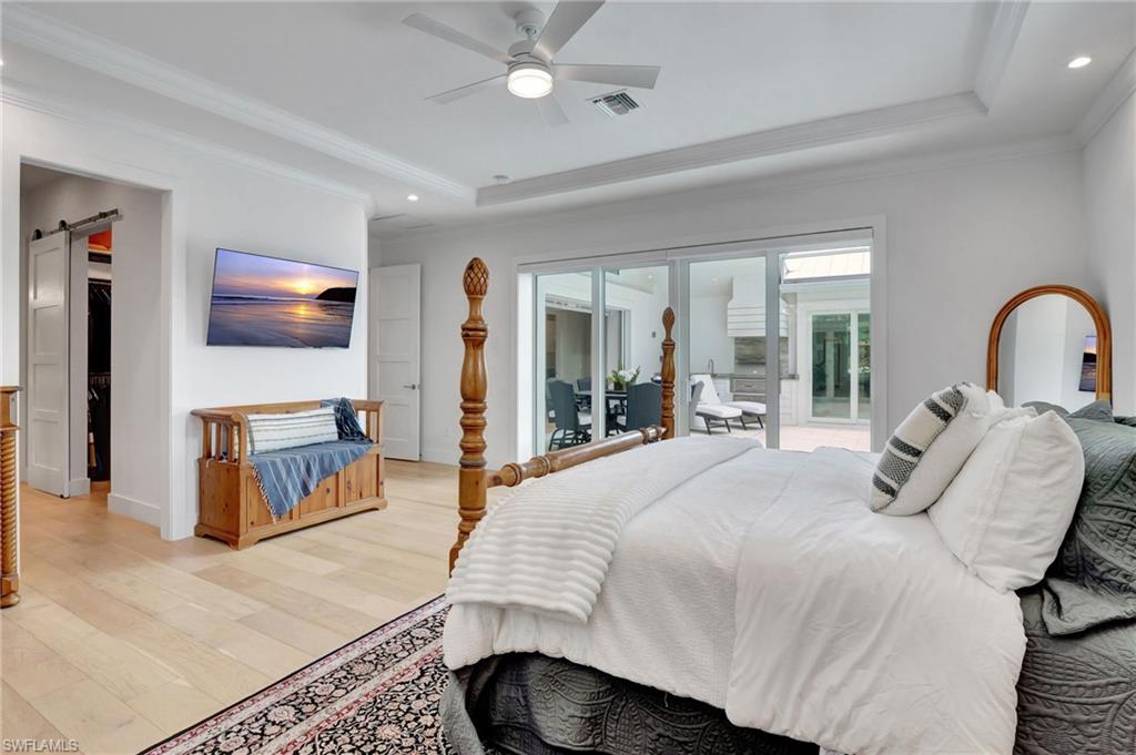 2120 Curtis Street Naples, FL 34112 - Photo 25 of 38 a bedroom with a bed couch and window