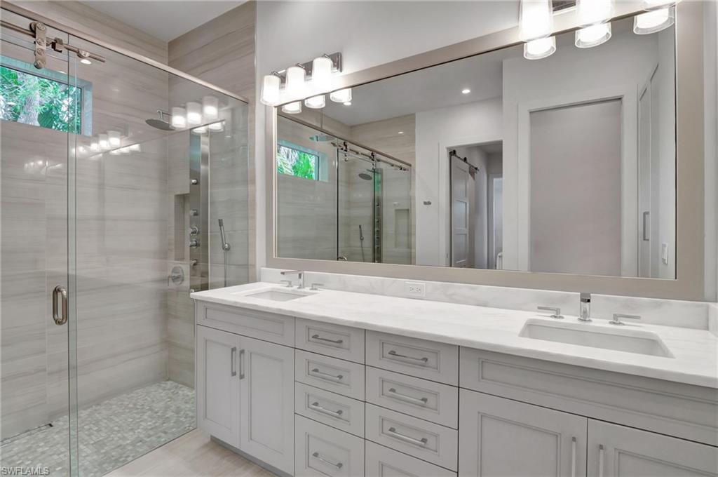2120 Curtis Street Naples, FL 34112 - Photo 27 of 38 a bathroom with a shower sink double and mirror