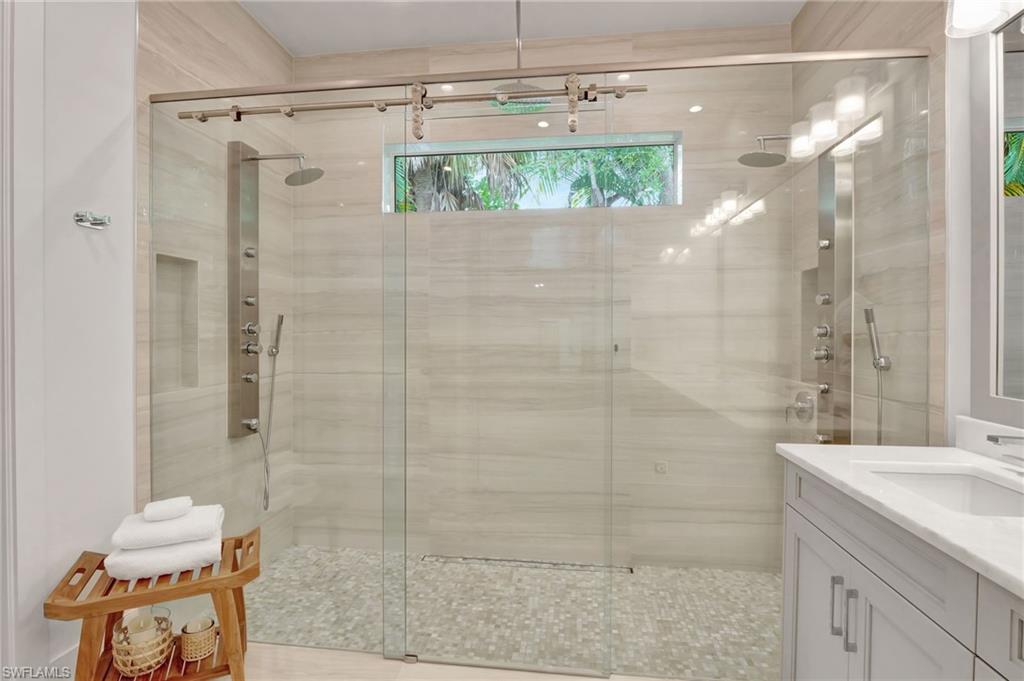 2120 Curtis Street Naples, FL 34112 - Photo 28 of 38 a bathroom with a shower and a sink