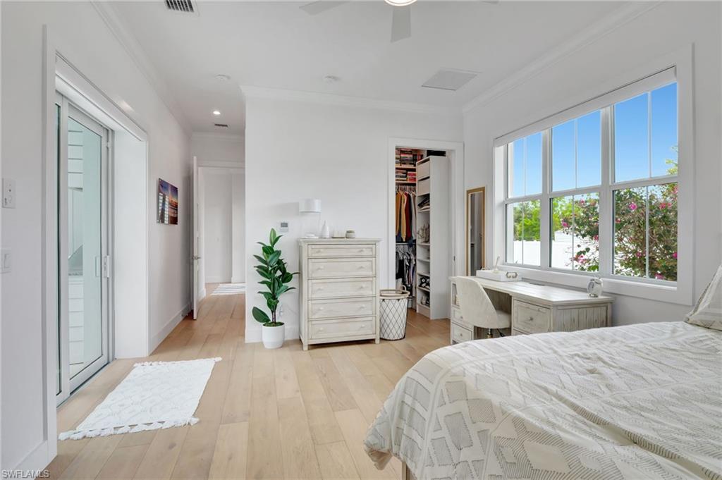 2120 Curtis Street Naples, FL 34112 - Photo 30 of 38 a bedroom with a bed and a dresser