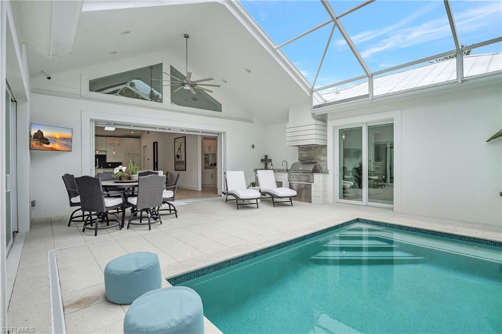 2120 Curtis Street Naples, FL 34112 - Photo 37 of 38 a living room with furniture and a large window