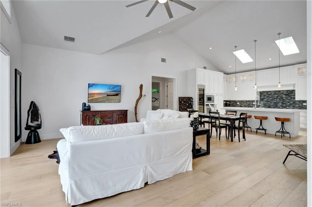 2120 Curtis Street Naples, FL 34112 - Photo 5 of 38 a living room with furniture and a dining table