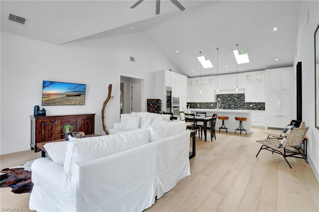 2120 Curtis Street Naples, FL 34112 - Photo 6 of 38 a living room with furniture and kitchen view