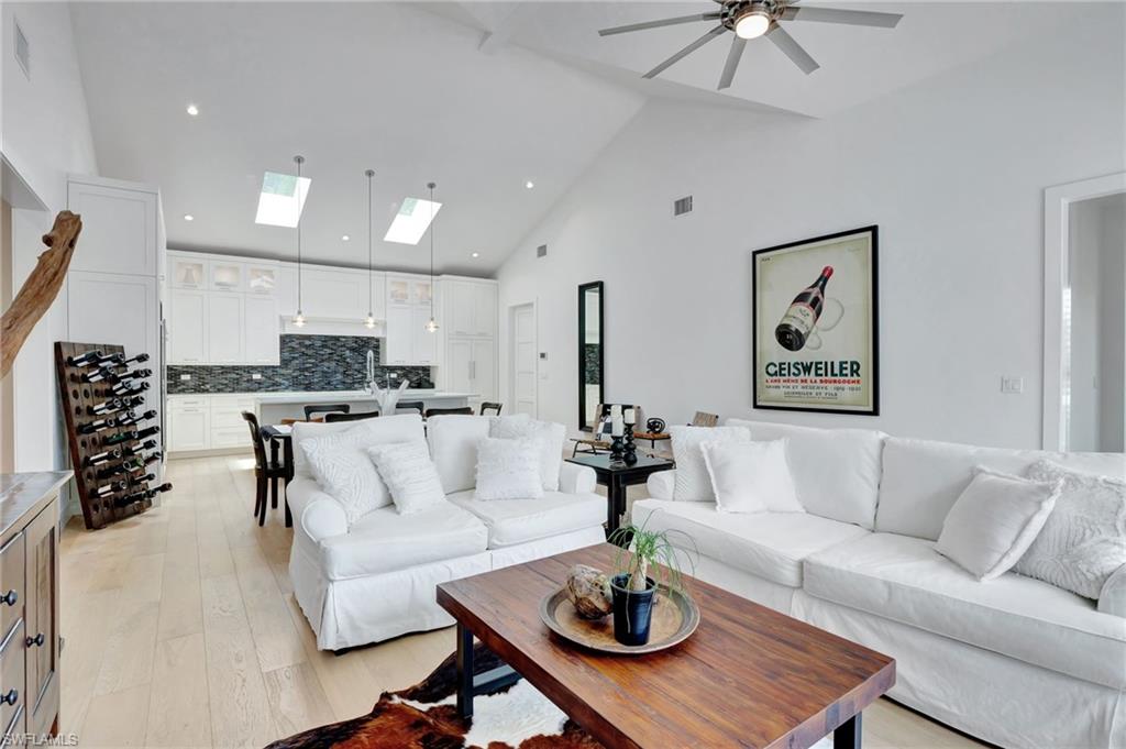 2120 Curtis Street Naples, FL 34112 - Photo 7 of 38 a living room with furniture kitchen view and a chandelier