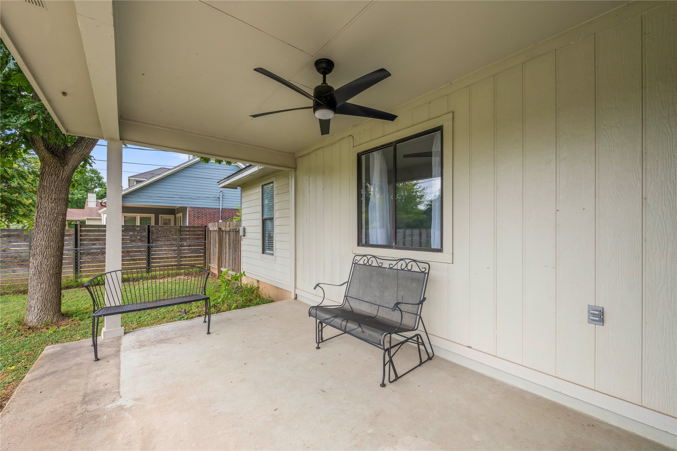 1329 Quail Ravine Round Rock, TX 78664 - Photo 17 of 39 An inviting covered patio offers a concrete floor and a clean, paneled exterior wall.