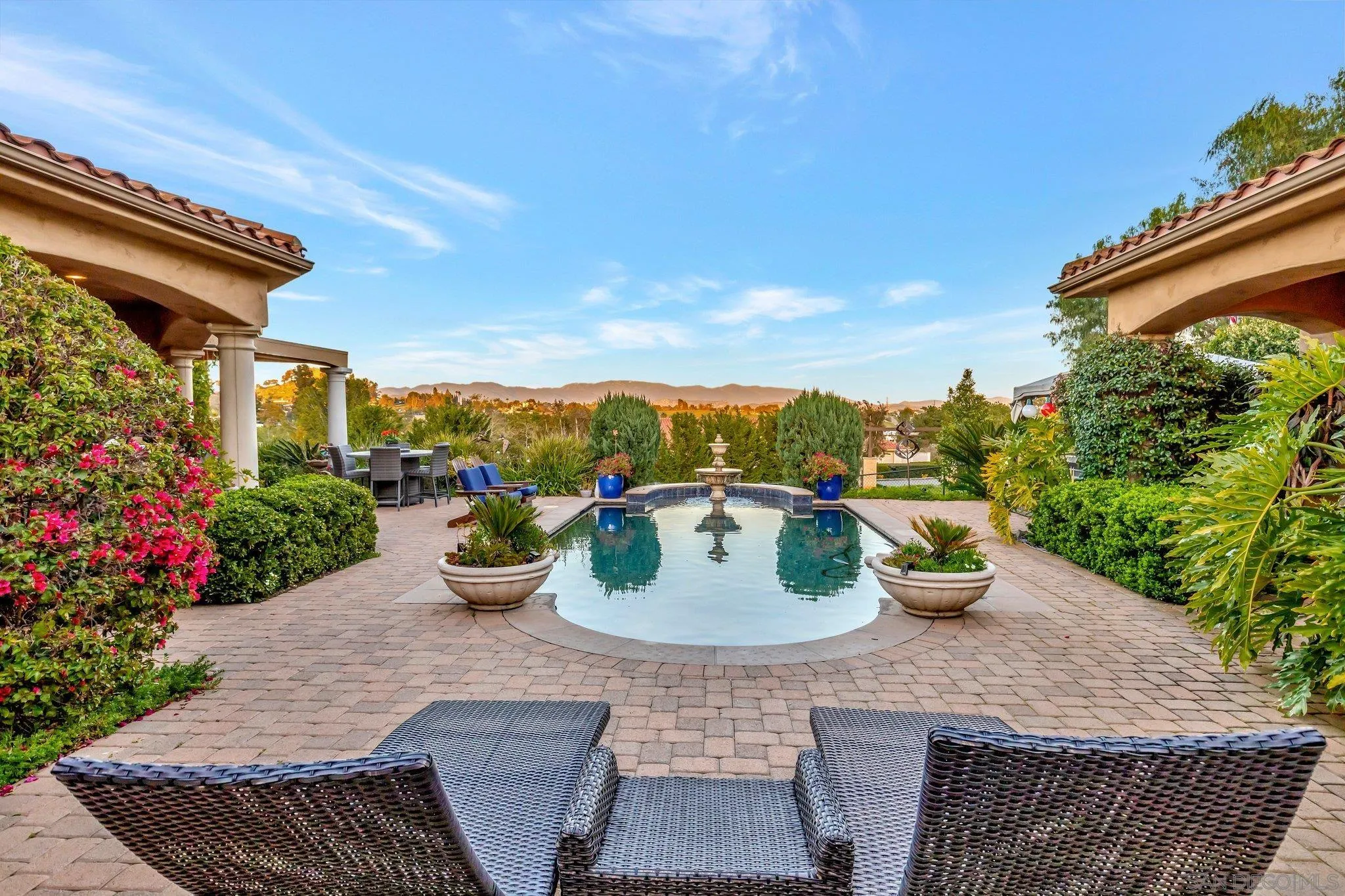 3401 Preakness Court Fallbrook, CA 92028 - Photo 13 of 52 a view of a backyard with sitting area and potted plants