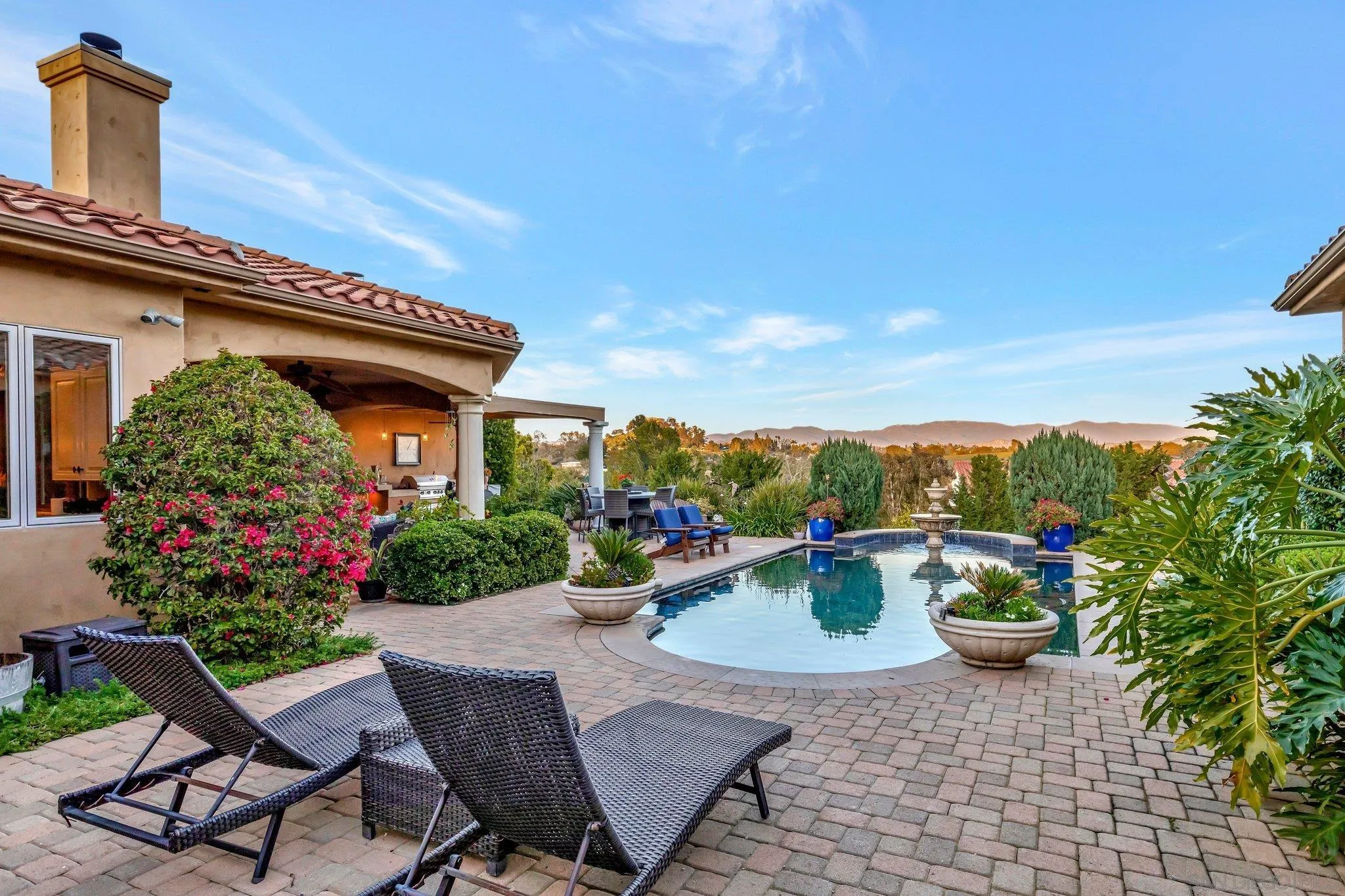 3401 Preakness Court Fallbrook, CA 92028 - Photo 14 of 52 a view of a patio with chair and tables back yard of the house