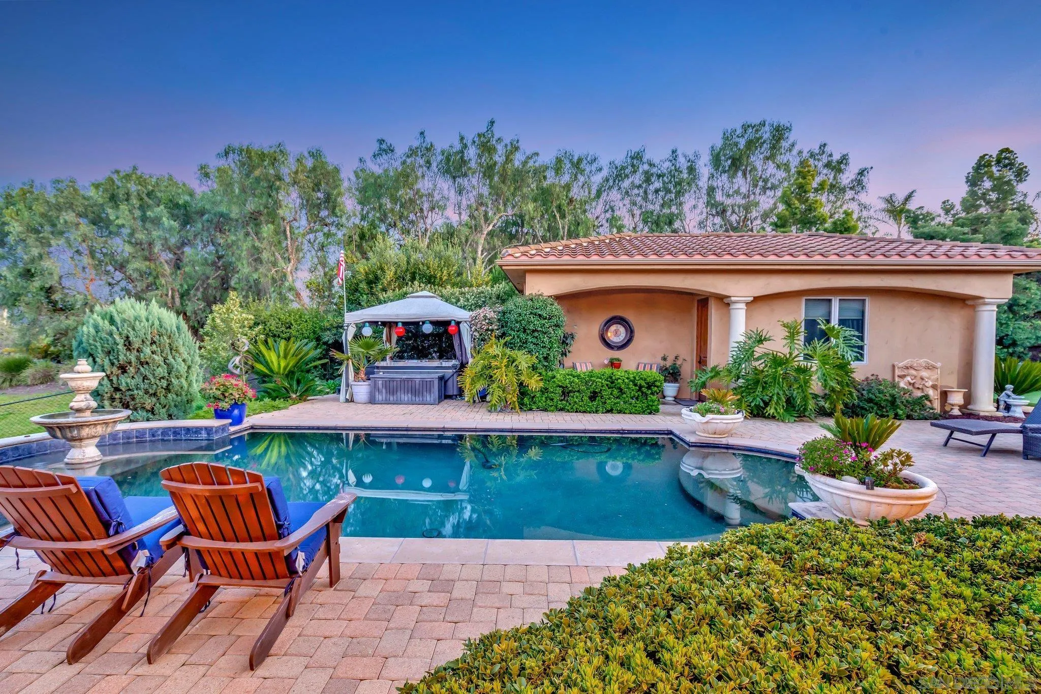 3401 Preakness Court Fallbrook, CA 92028 - Photo 16 of 52 a backyard of a house with table and chairs