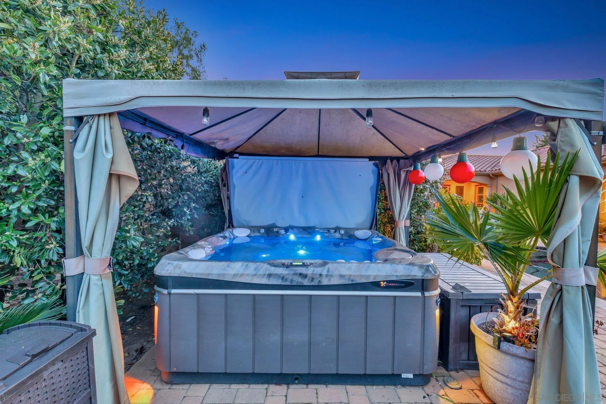 3401 Preakness Court Fallbrook, CA 92028 - Photo 17 of 52 a view of a backyard with table and chairs under an umbrella