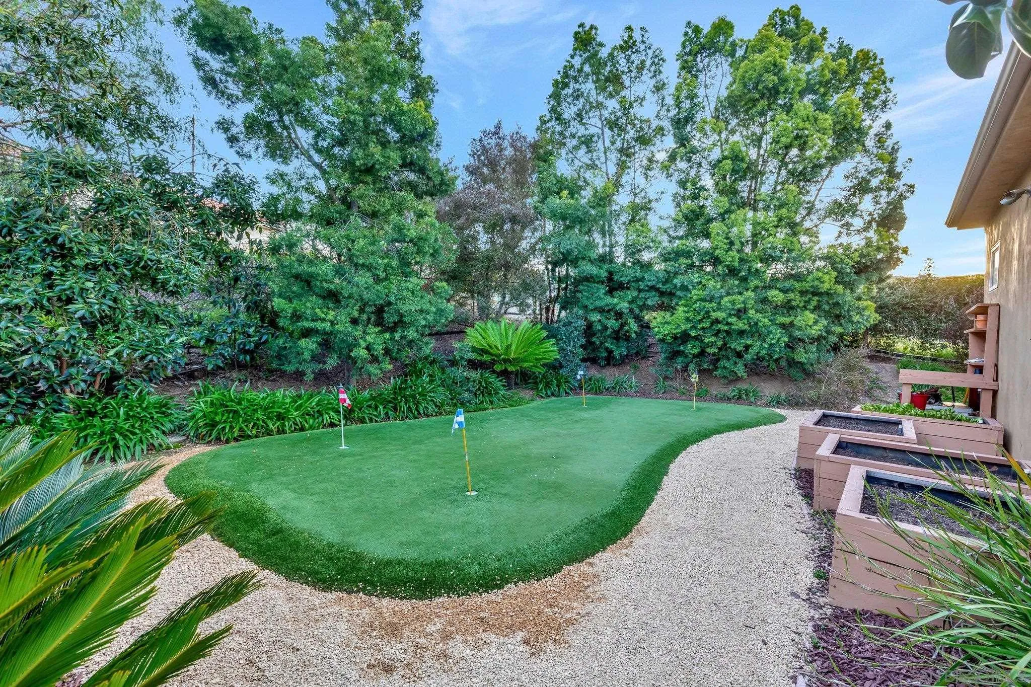3401 Preakness Court Fallbrook, CA 92028 - Photo 18 of 52 a view of a garden with a slide