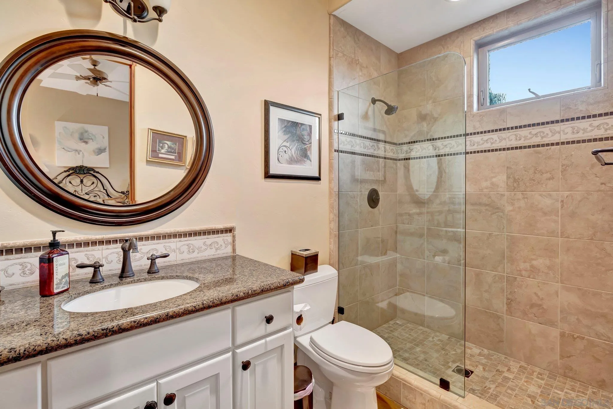 3401 Preakness Court Fallbrook, CA 92028 - Photo 33 of 52 a bathroom with a sink a toilet and a mirror