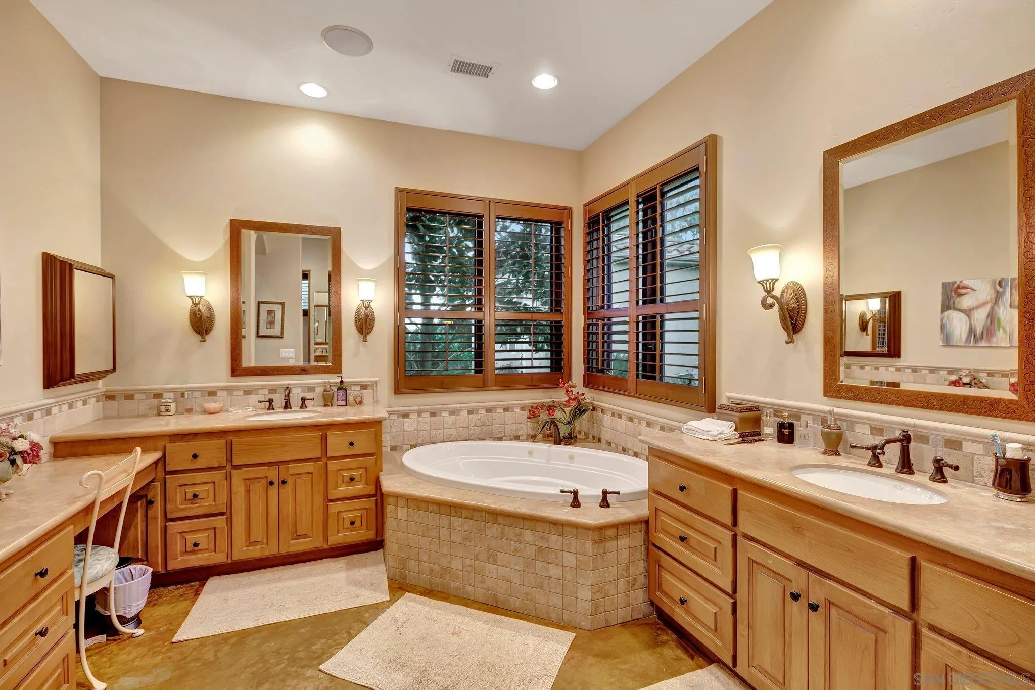 3401 Preakness Court Fallbrook, CA 92028 - Photo 37 of 52 a bathroom with a granite countertop double vanity sink a large mirror and a bathtub