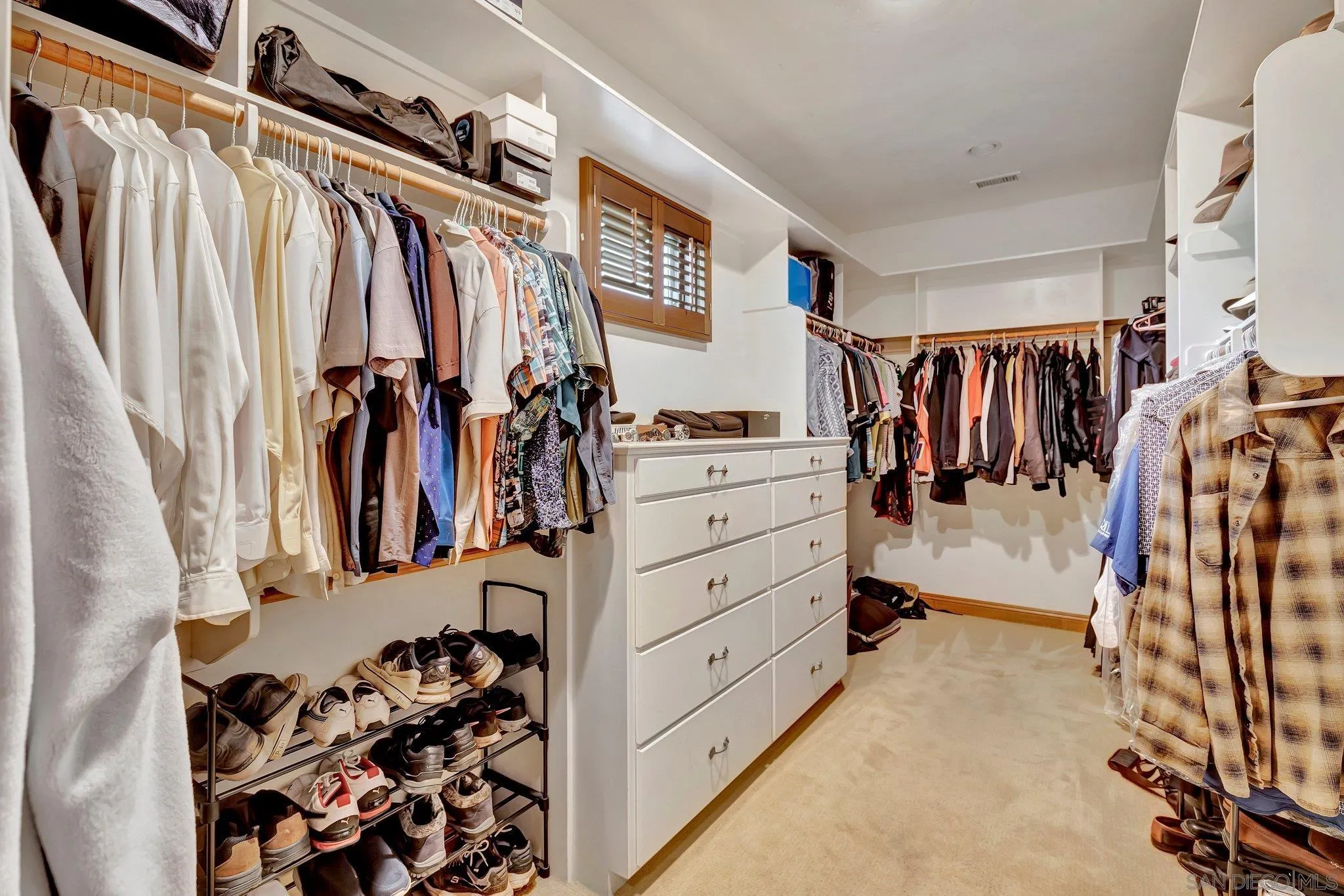 3401 Preakness Court Fallbrook, CA 92028 - Photo 39 of 52 a view of walk in closet with clothes and shoes