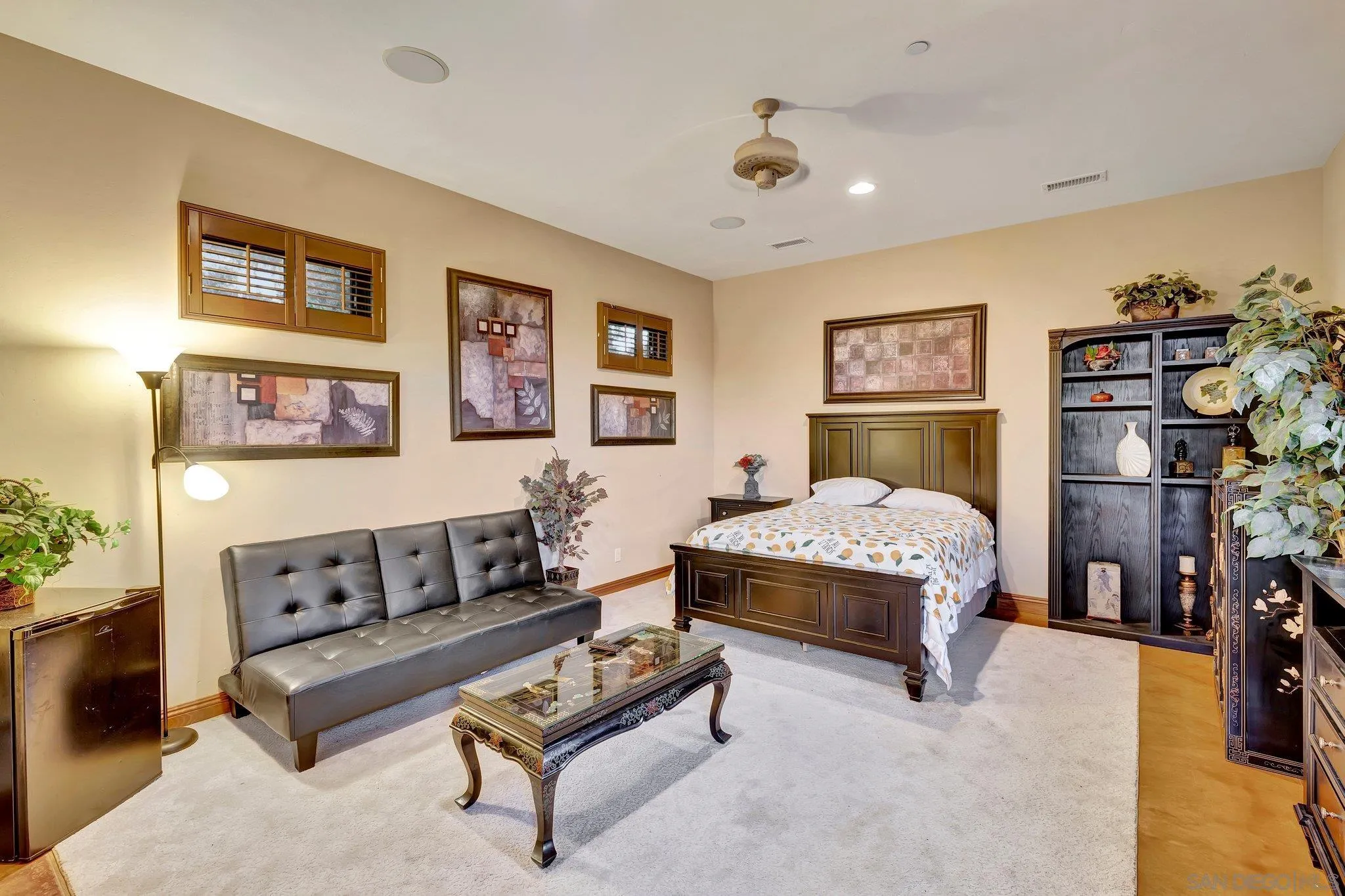 3401 Preakness Court Fallbrook, CA 92028 - Photo 40 of 52 a spacious bedroom with a bed and a couch