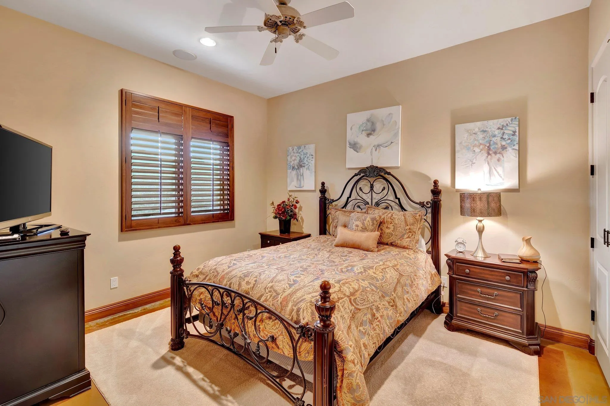 3401 Preakness Court Fallbrook, CA 92028 - Photo 42 of 52 a bedroom with a bed and a chandelier
