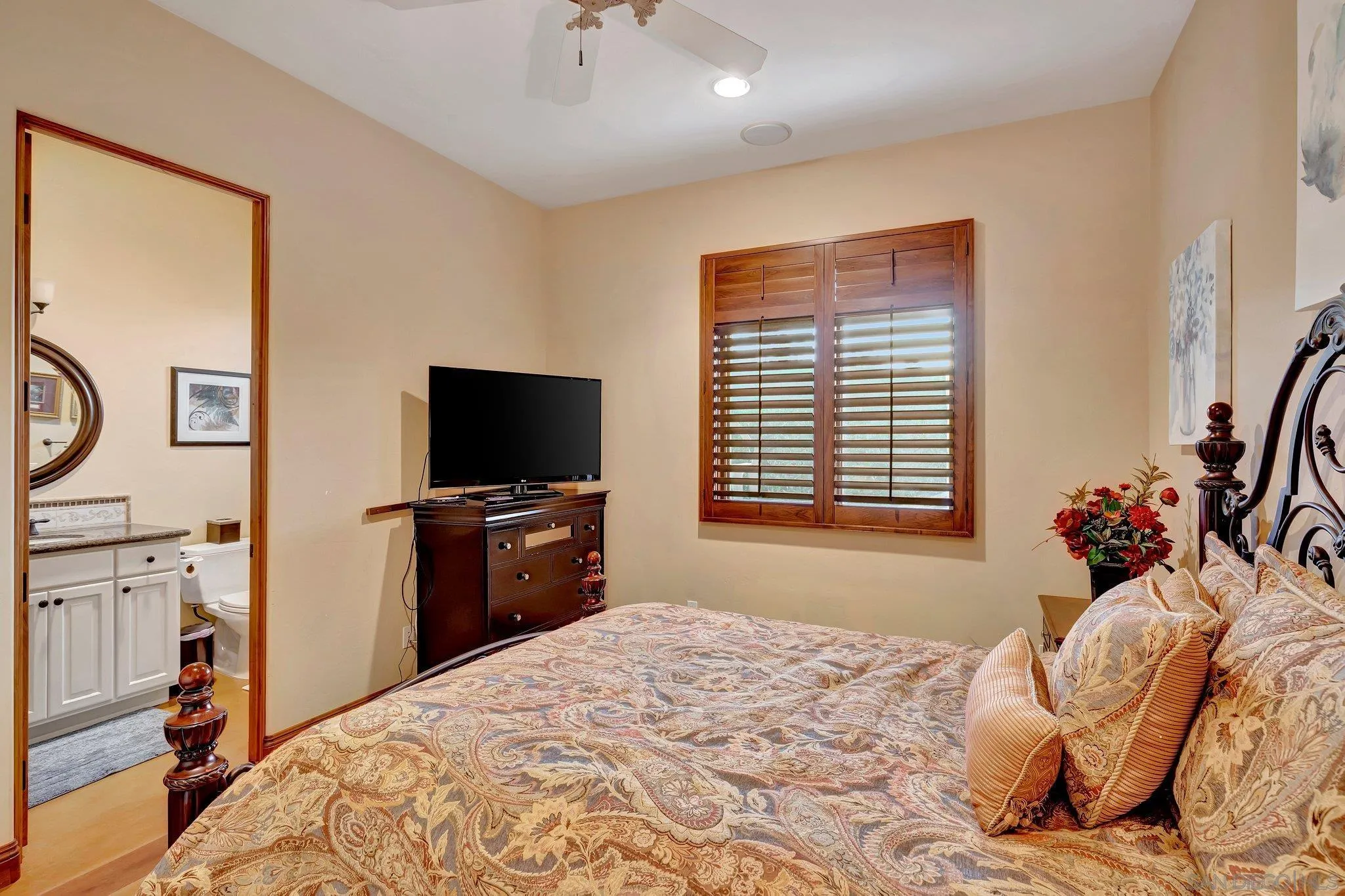 3401 Preakness Court Fallbrook, CA 92028 - Photo 43 of 52 a bedroom with a bed and a flat screen tv