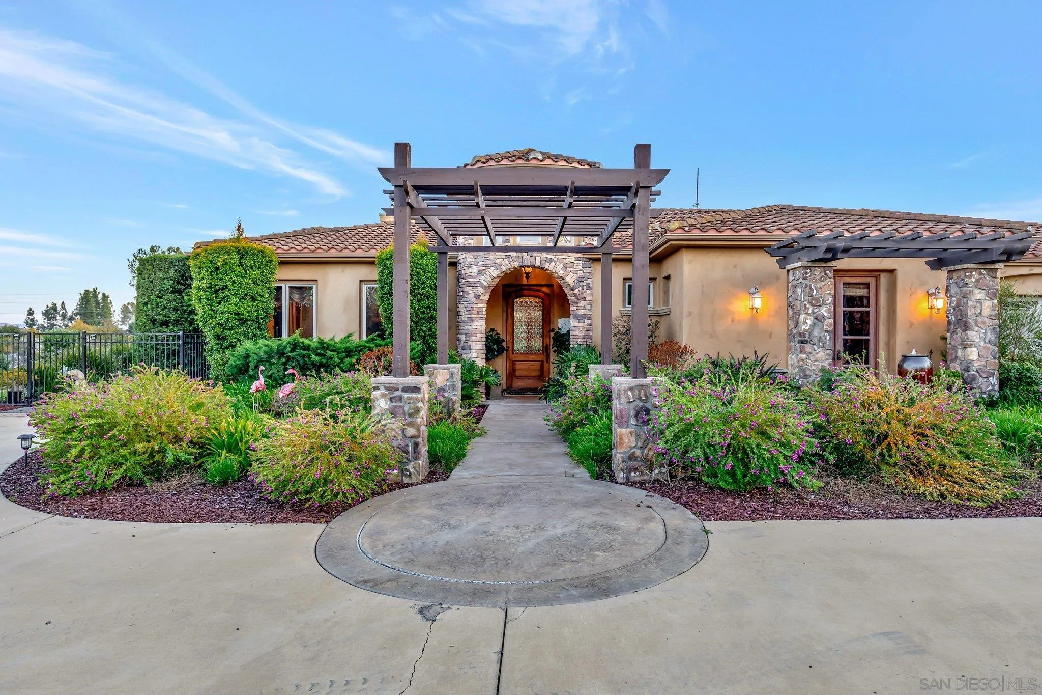 3401 Preakness Court Fallbrook, CA 92028 - Photo 46 of 52 a front view of a house with a garden
