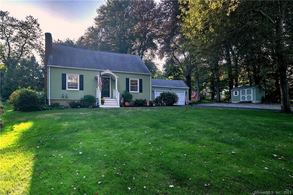 518 Ferry Road Orange, CT 06477 - Photo 1 of 1 a front view of house with yard and green space