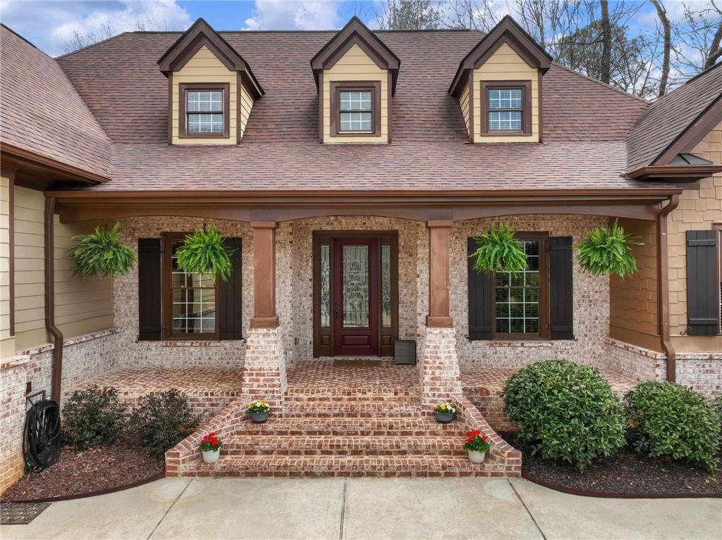 a front view of a house with garden