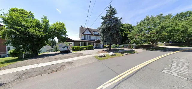 a view of street with sitting area