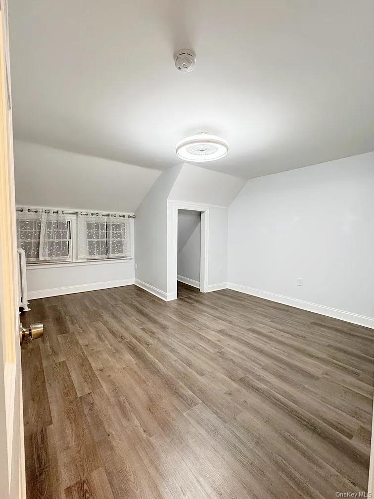 57 Pintard Avenue, Unit 3 New Rochelle, NY 10801 - Photo 3 of 23 an empty room with wooden floor and windows