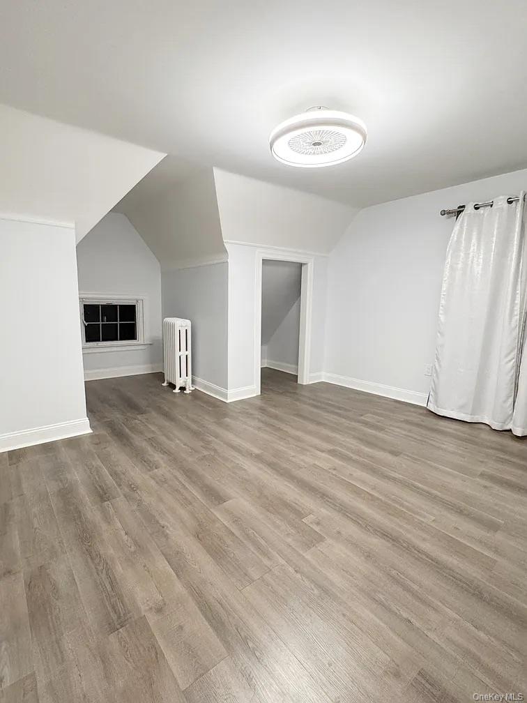 57 Pintard Avenue, Unit 3 New Rochelle, NY 10801 - Photo 5 of 23 an empty room with wooden floor and window