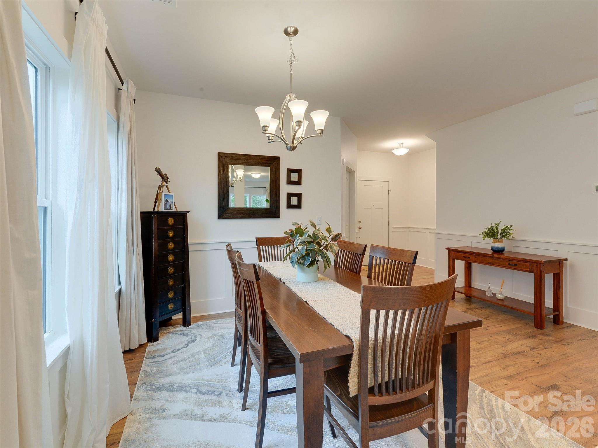 1928 Thoreau Way York, SC 29745 - Photo 19 of 43 a view of a dining room with furniture and chandelier