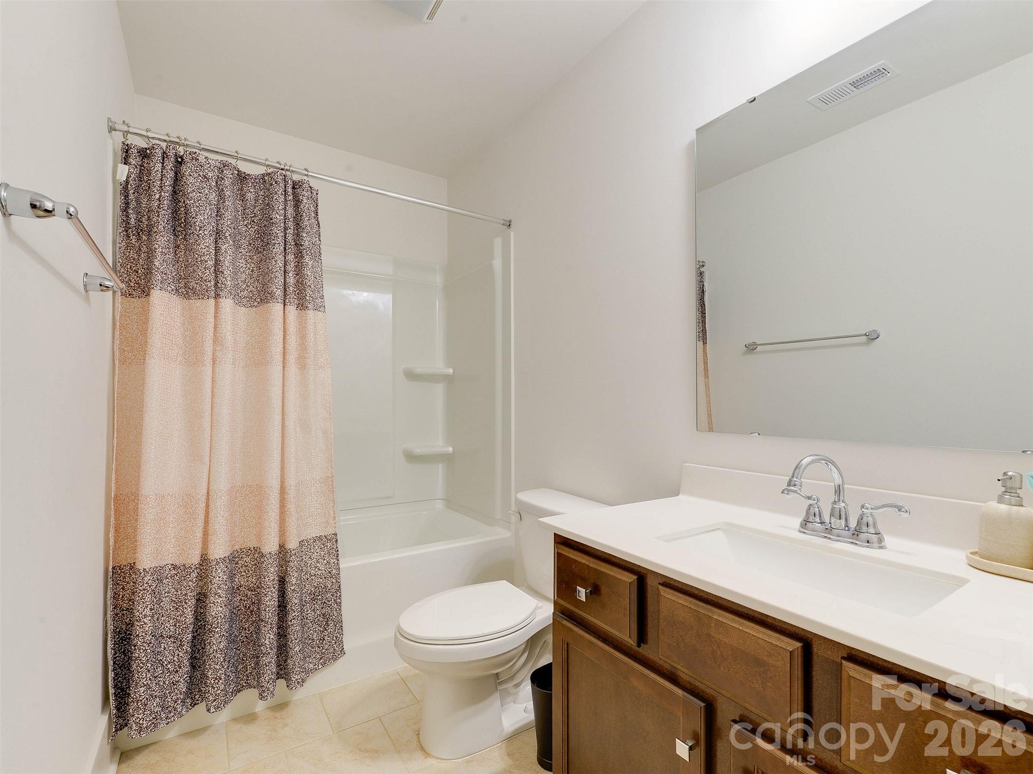 1928 Thoreau Way York, SC 29745 - Photo 24 of 43 a bathroom with a sink a toilet and shower