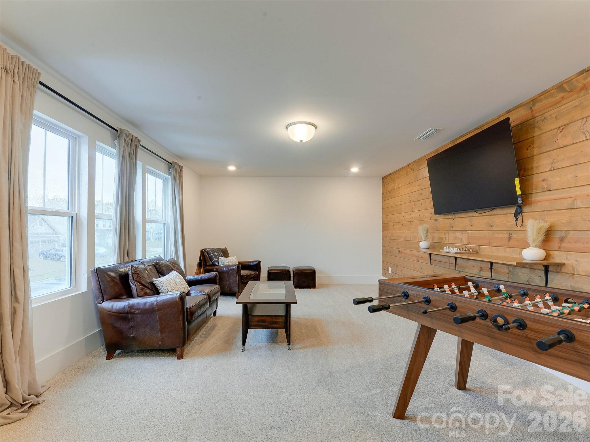 1928 Thoreau Way York, SC 29745 - Photo 25 of 43 a living room with furniture and a flat screen tv