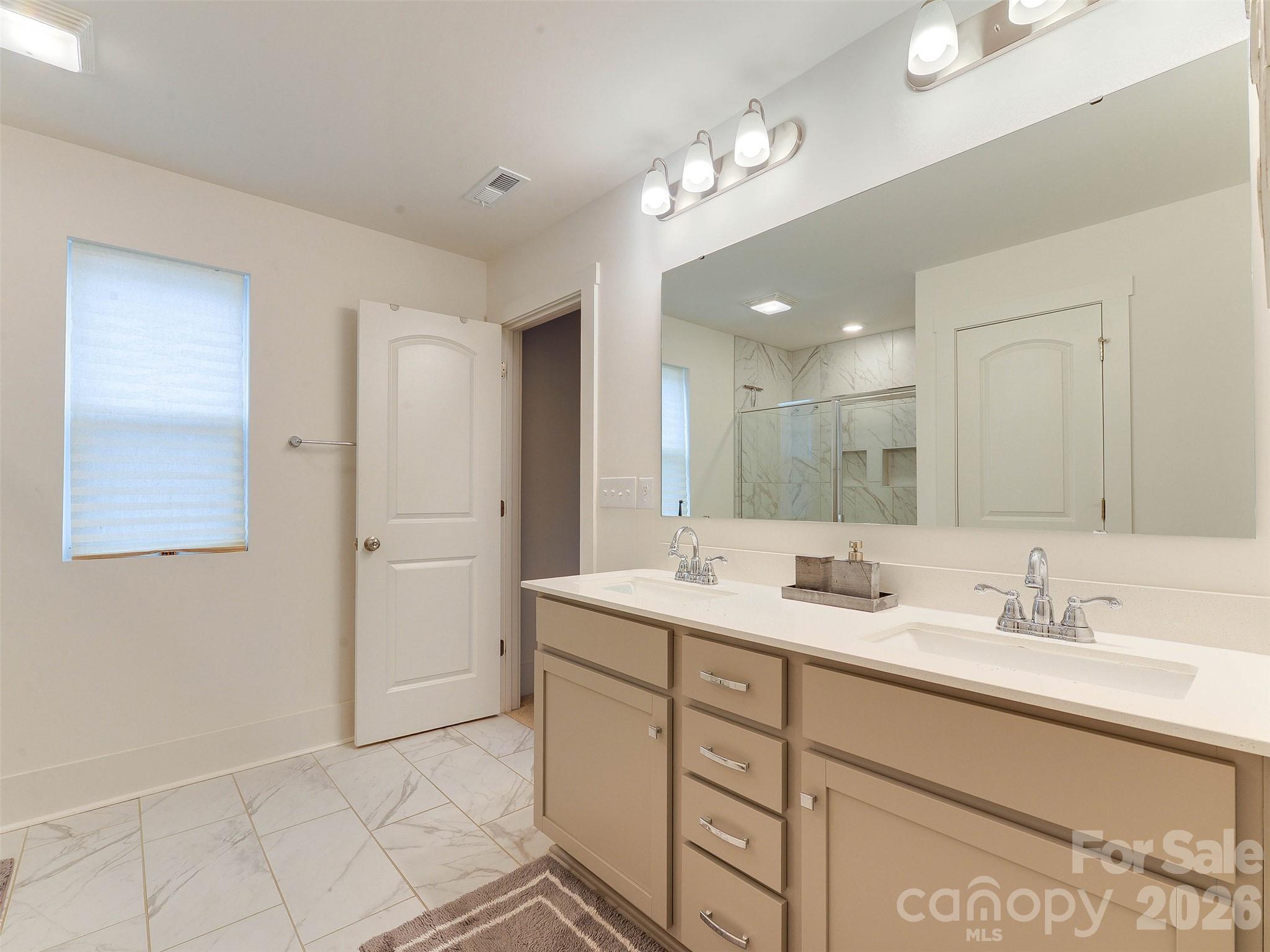 1928 Thoreau Way York, SC 29745 - Photo 29 of 43 a bathroom with a sink double vanity and a mirror