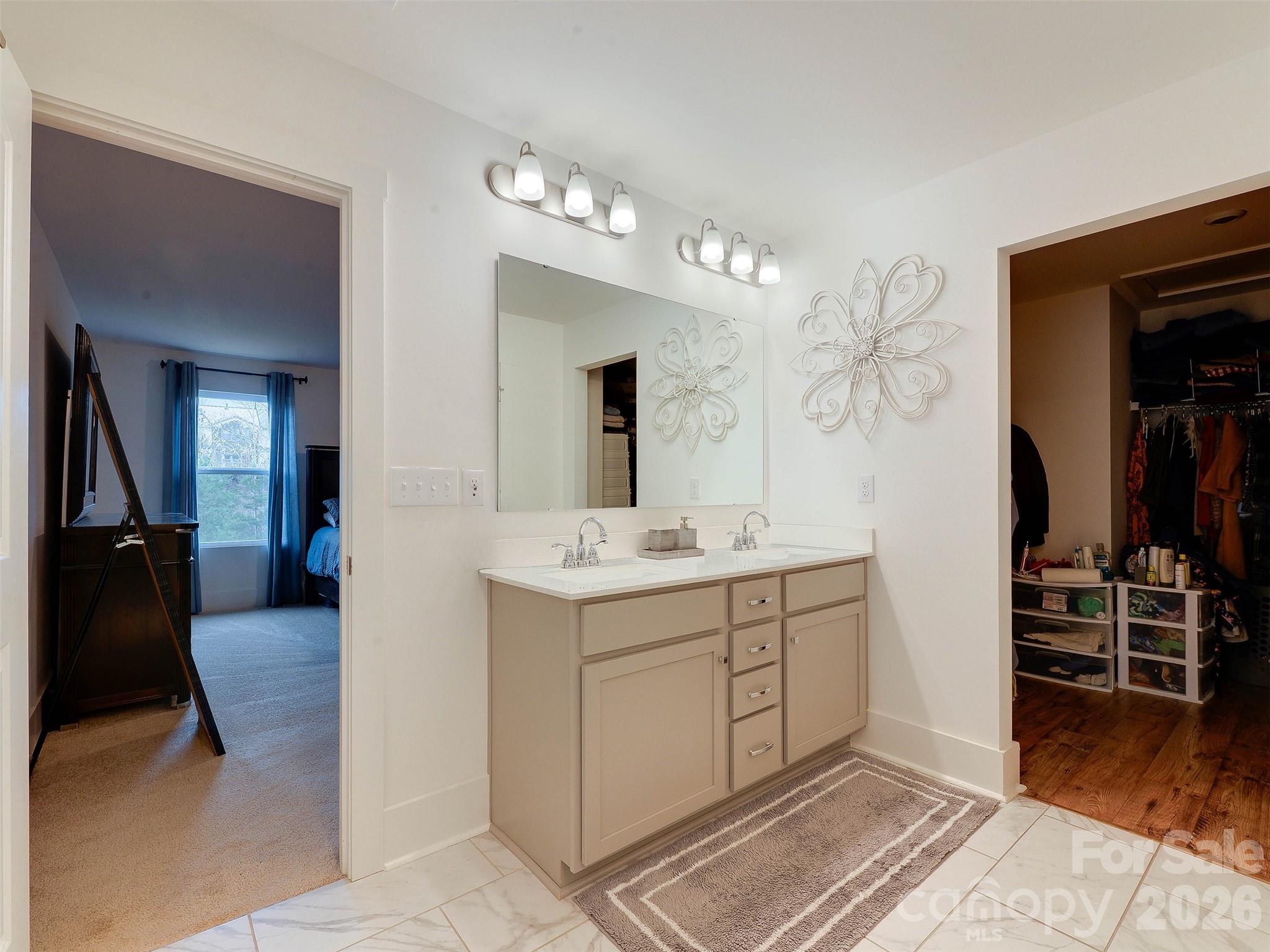 1928 Thoreau Way York, SC 29745 - Photo 30 of 43 a spacious bathroom with a double vanity sink and a mirror