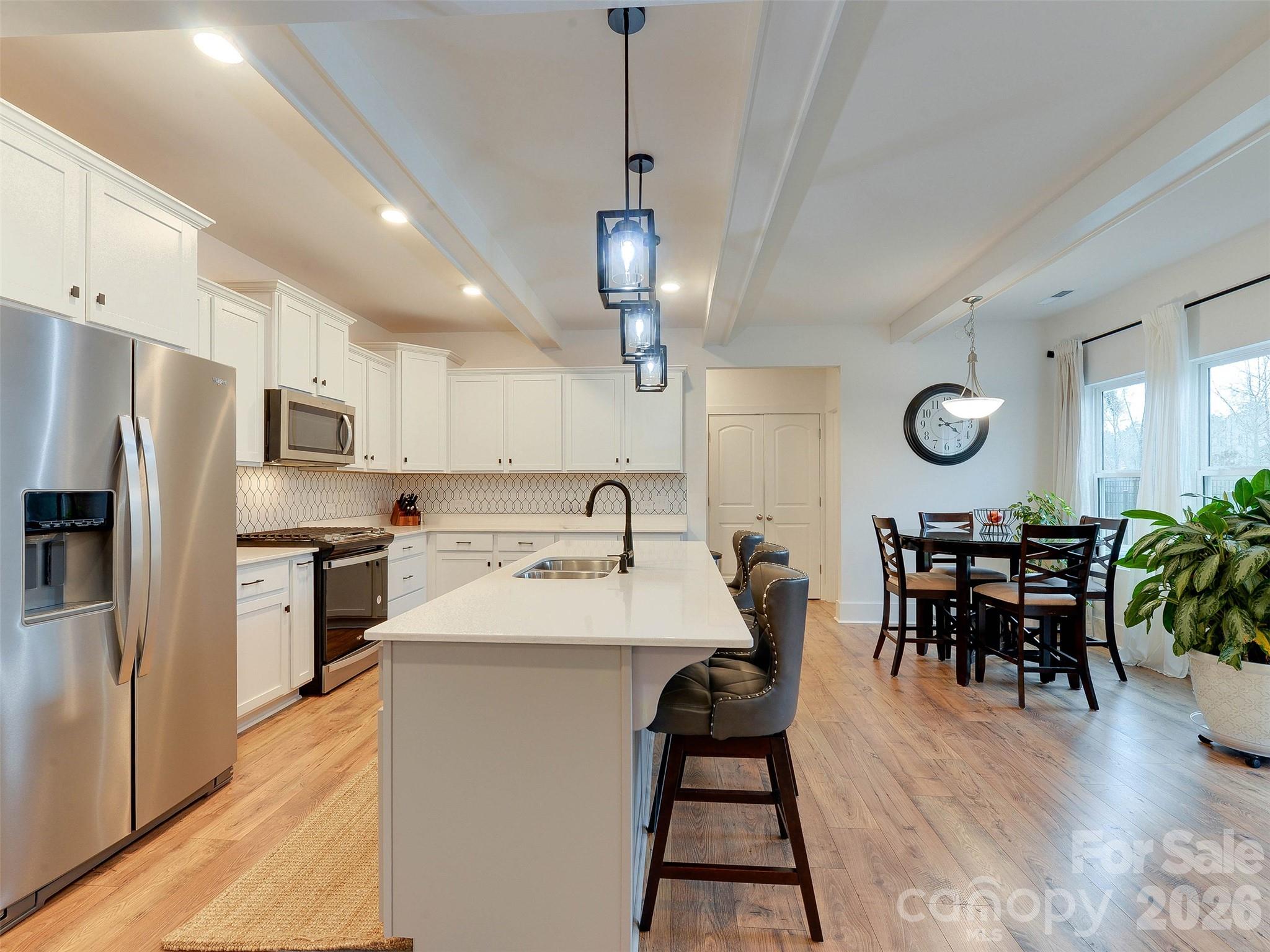 1928 Thoreau Way York, SC 29745 - Photo 10 of 43 a large kitchen with a table and chairs