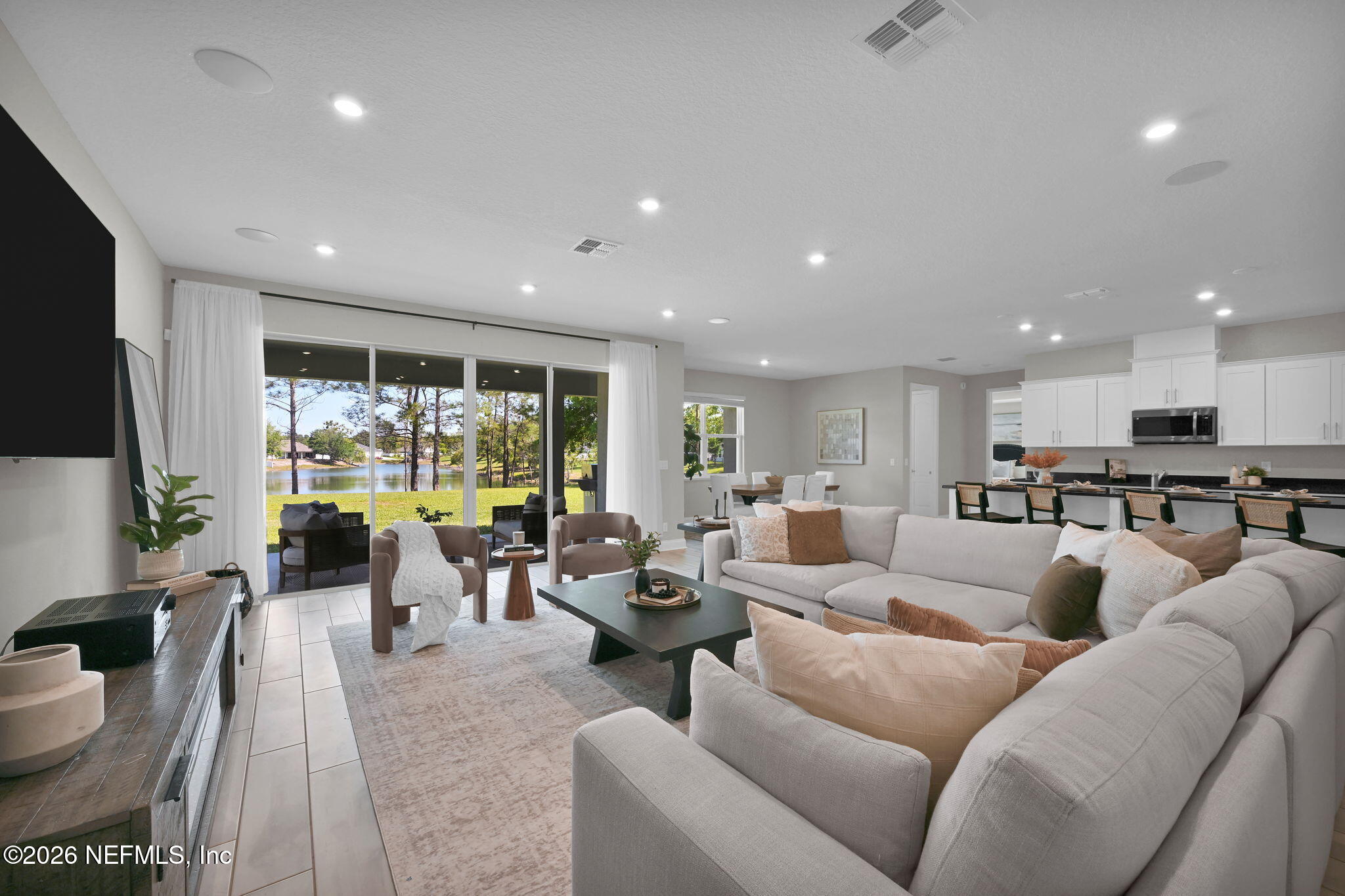 4050 Coyote Court Middleburg, FL 32068 - Photo 13 of 93 a living room with furniture fireplace and a large window