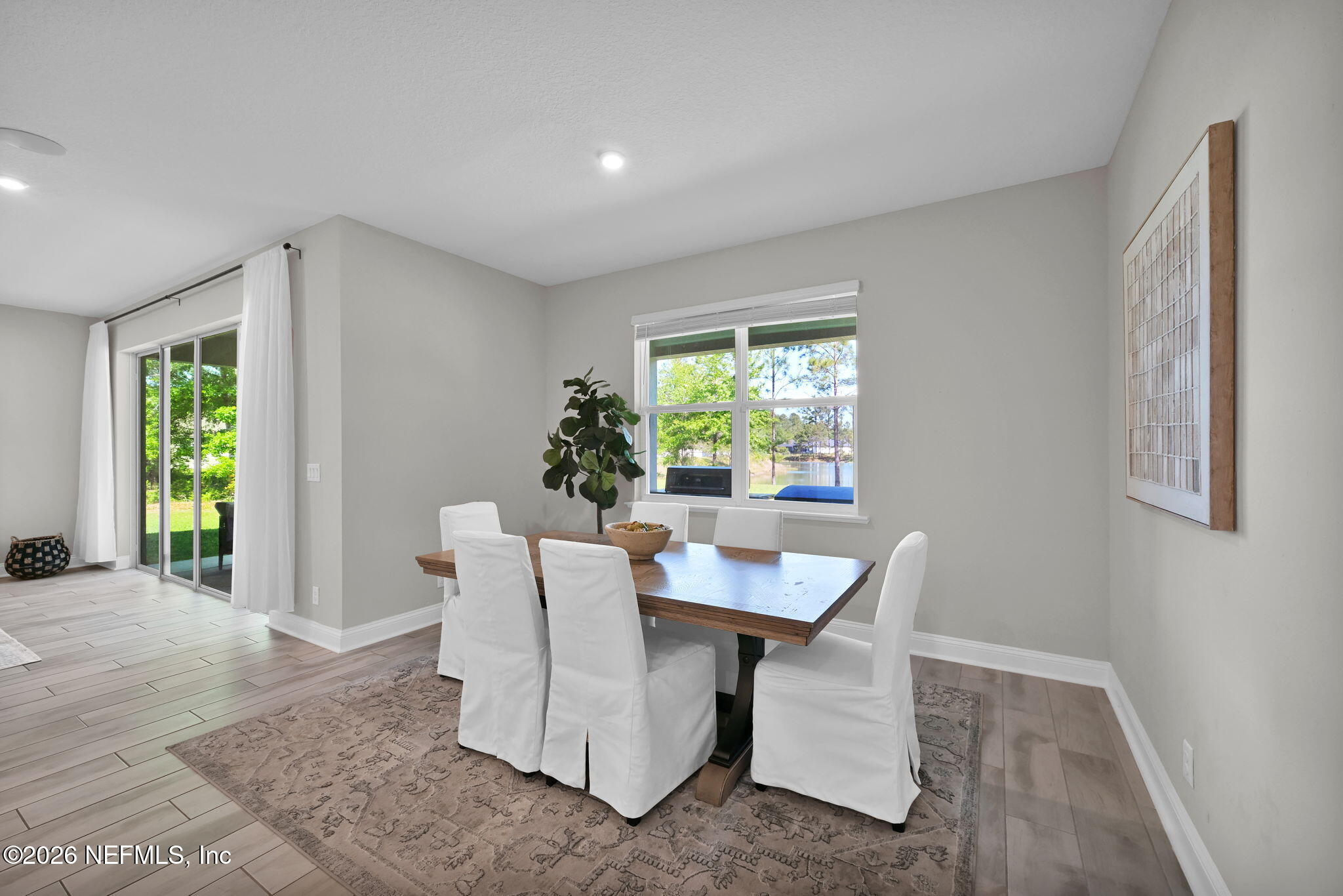 4050 Coyote Court Middleburg, FL 32068 - Photo 26 of 93 a dining room with furniture and window