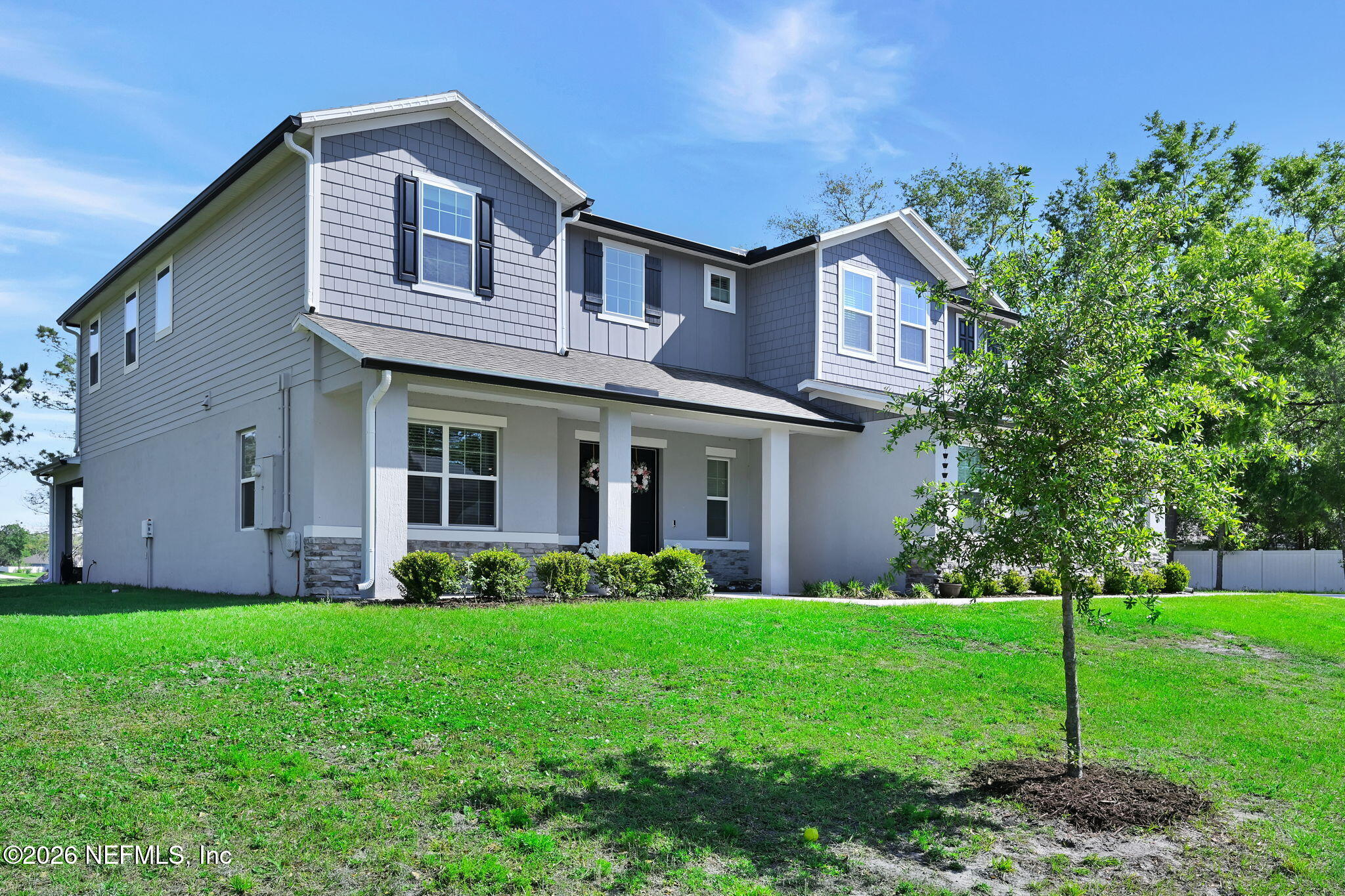 4050 Coyote Court Middleburg, FL 32068 - Photo 3 of 93 a front view of the house with garden and trees
