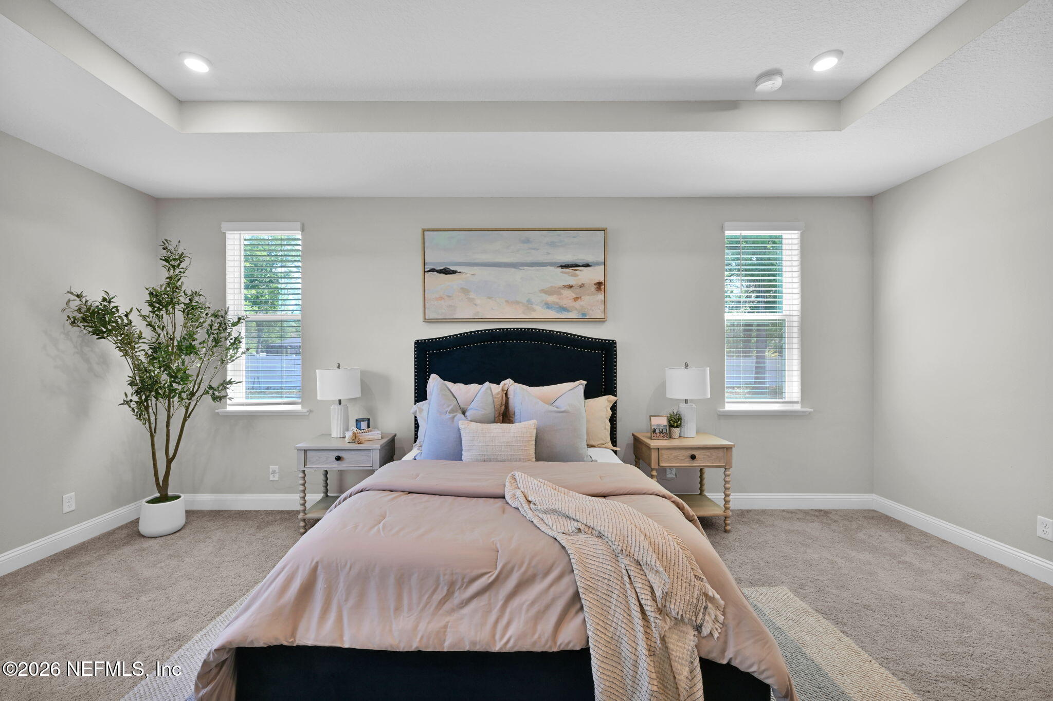 4050 Coyote Court Middleburg, FL 32068 - Photo 32 of 93 a bedroom with a bed and a potted plant