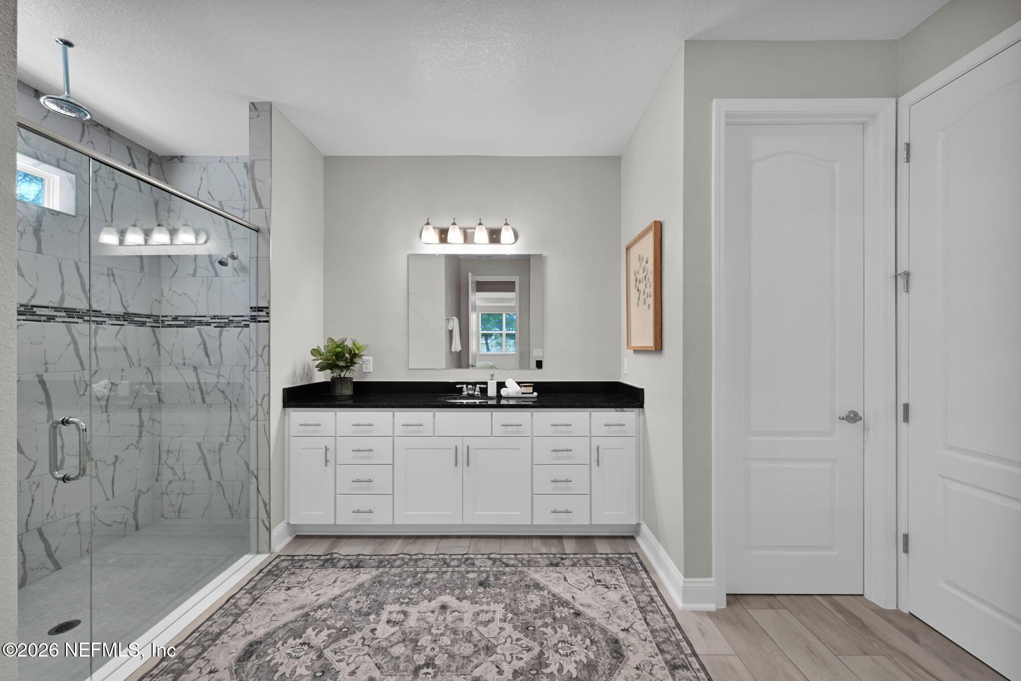 4050 Coyote Court Middleburg, FL 32068 - Photo 34 of 93 a bathroom with a sink and a mirror