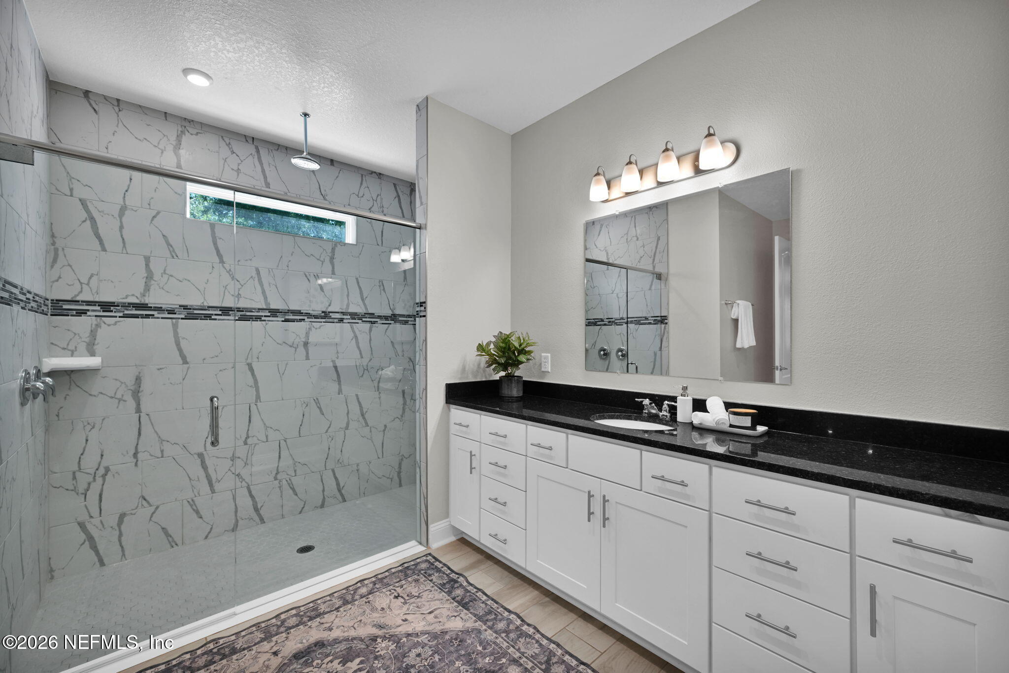 4050 Coyote Court Middleburg, FL 32068 - Photo 35 of 93 a bathroom with a double vanity sink and a mirror