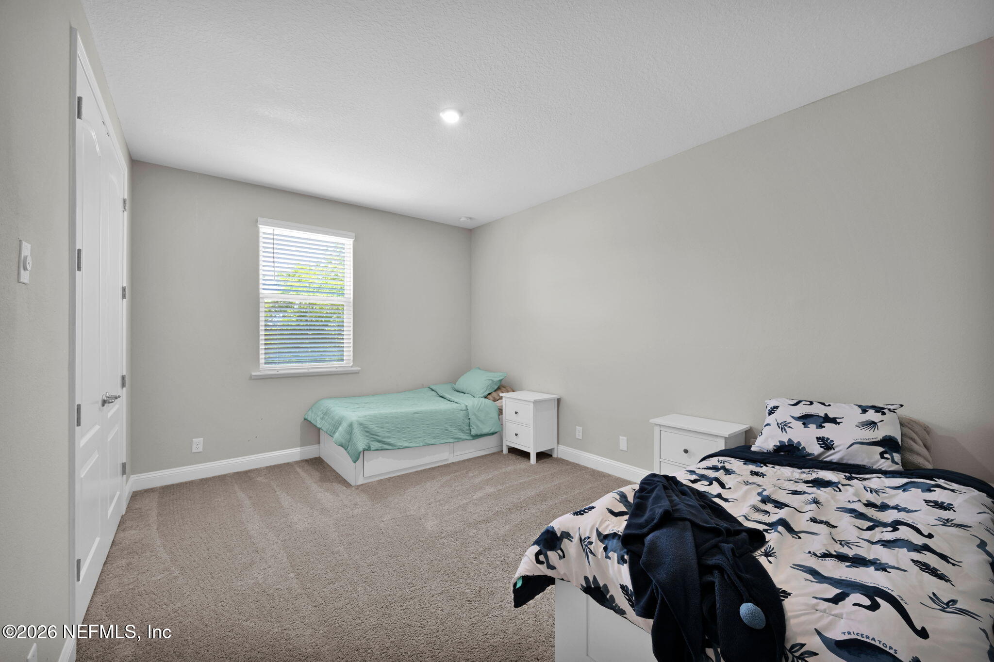 4050 Coyote Court Middleburg, FL 32068 - Photo 45 of 93 a bedroom with a bed and a window