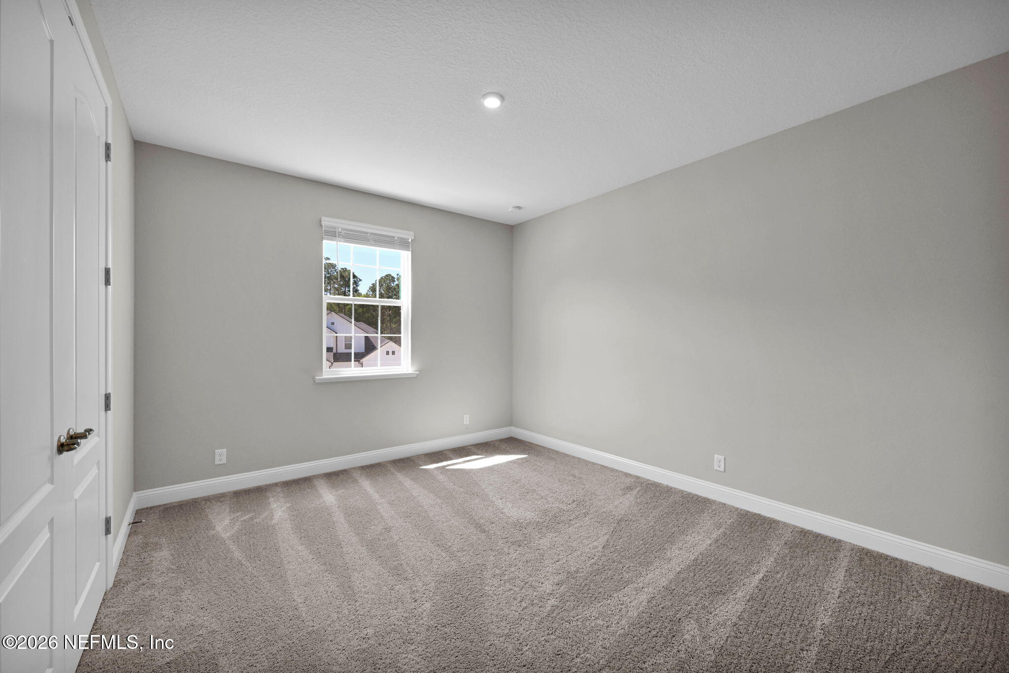 4050 Coyote Court Middleburg, FL 32068 - Photo 54 of 93 a view of an empty room with a window