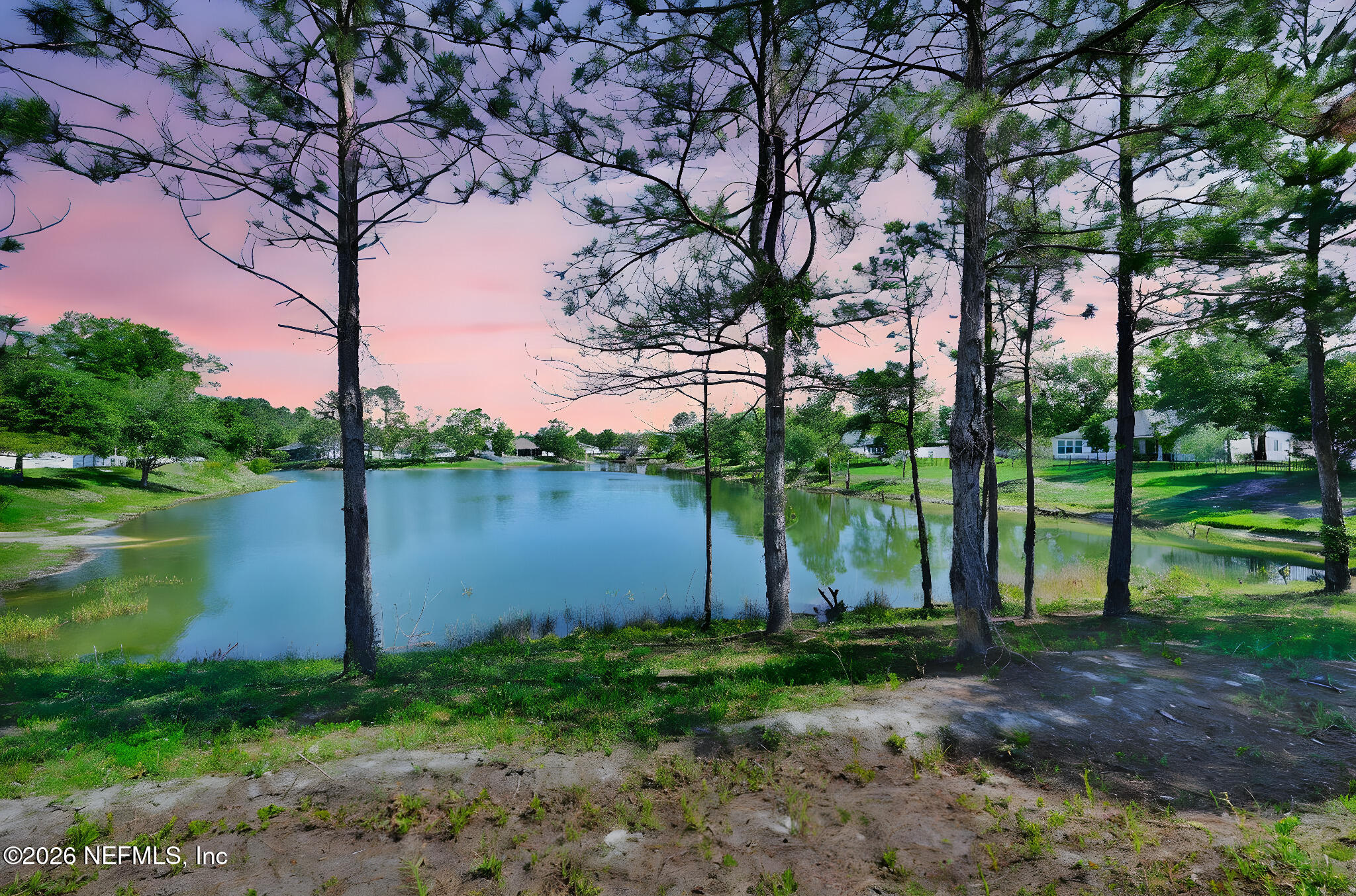 4050 Coyote Court Middleburg, FL 32068 - Photo 75 of 93 a backyard of a house with lots of green space and fountain