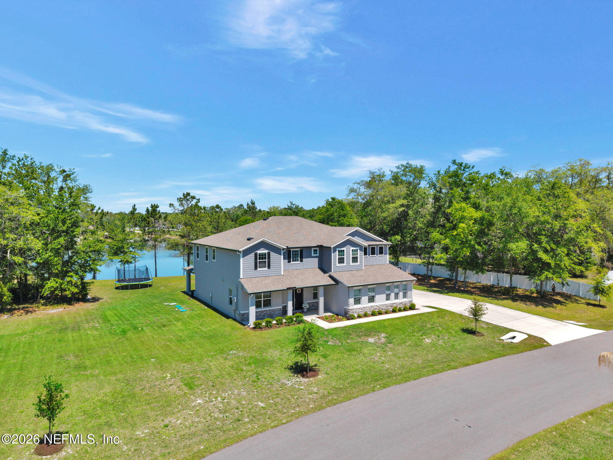 4050 Coyote Court Middleburg, FL 32068 - Photo 76 of 93 a view of a house with a big yard and large trees