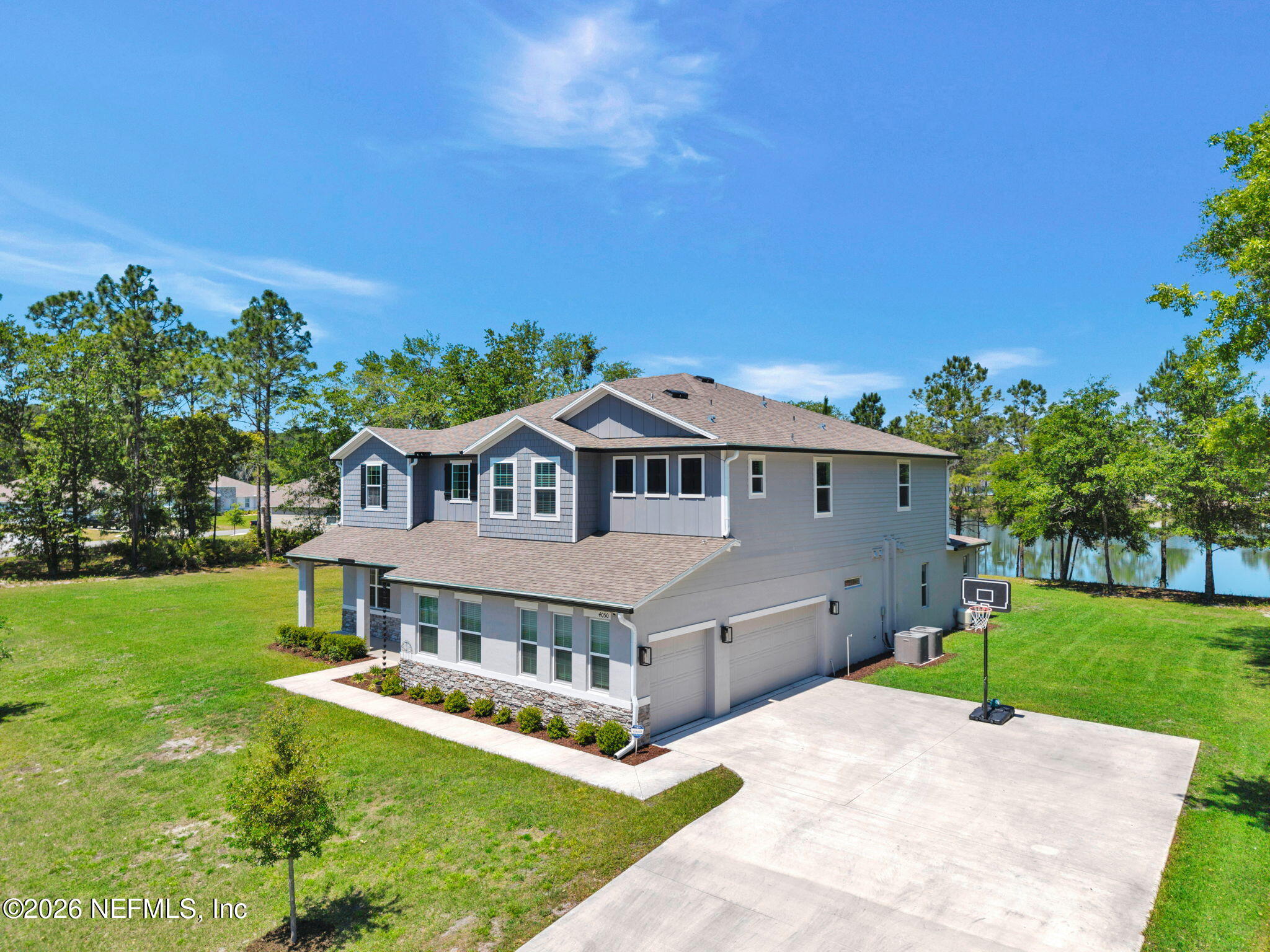 4050 Coyote Court Middleburg, FL 32068 - Photo 78 of 93 a aerial view of a house with a big yard plants and large trees