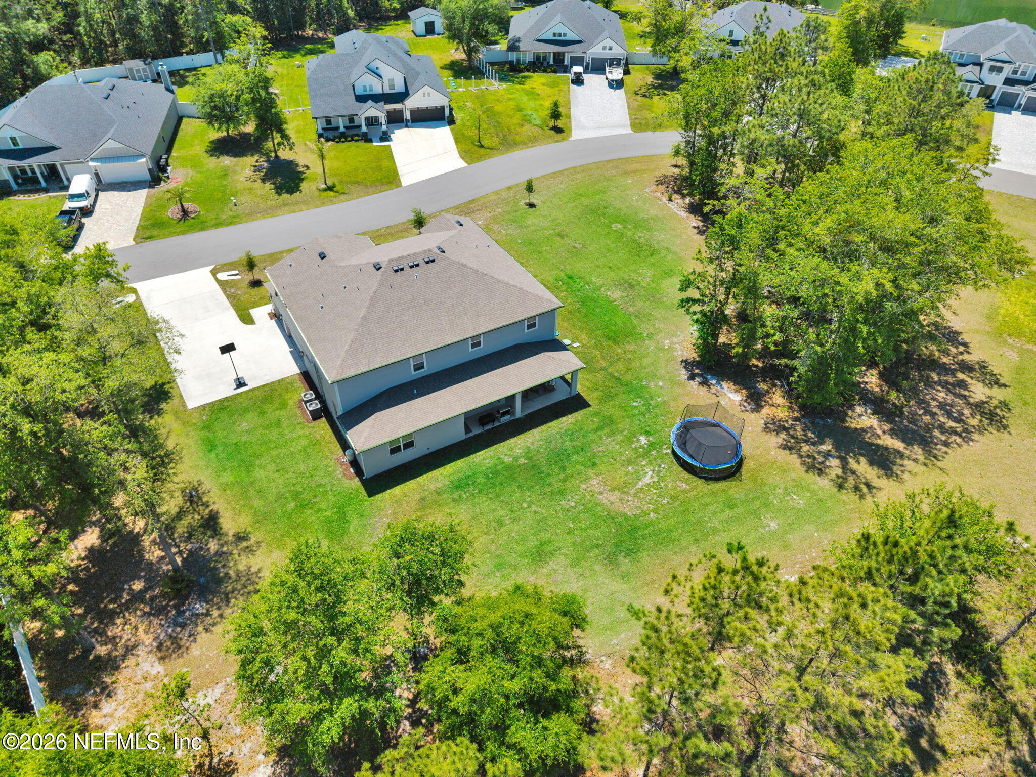 4050 Coyote Court Middleburg, FL 32068 - Photo 92 of 93 an aerial view of a house with a swimming pool yard and outdoor seating