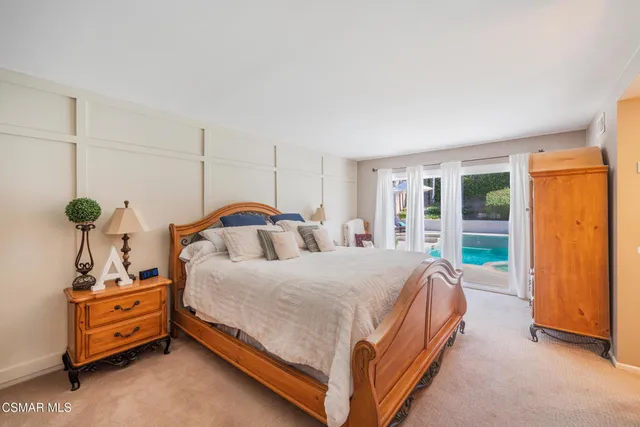 a bedroom with bed and window