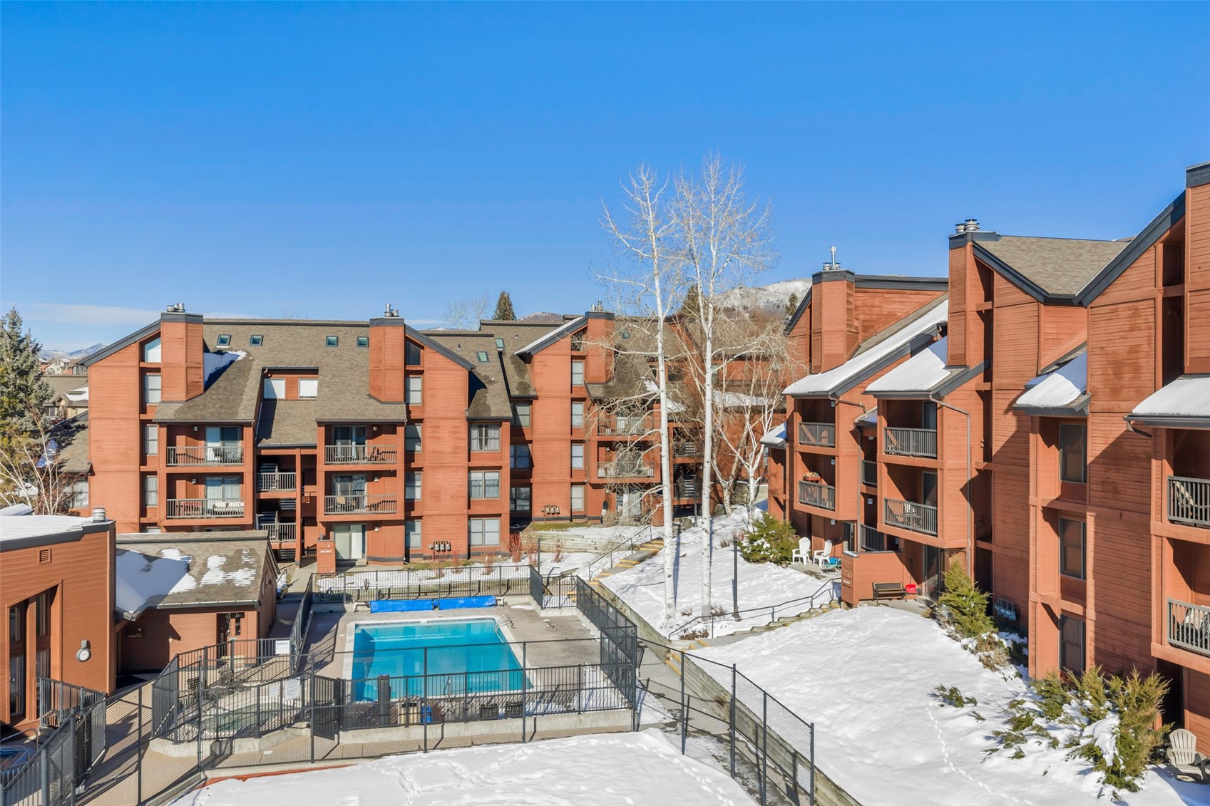2025 Walton Creek Road, Unit 401 Steamboat Springs, CO 80487 - Photo 36 of 38 front view of a building with a garden