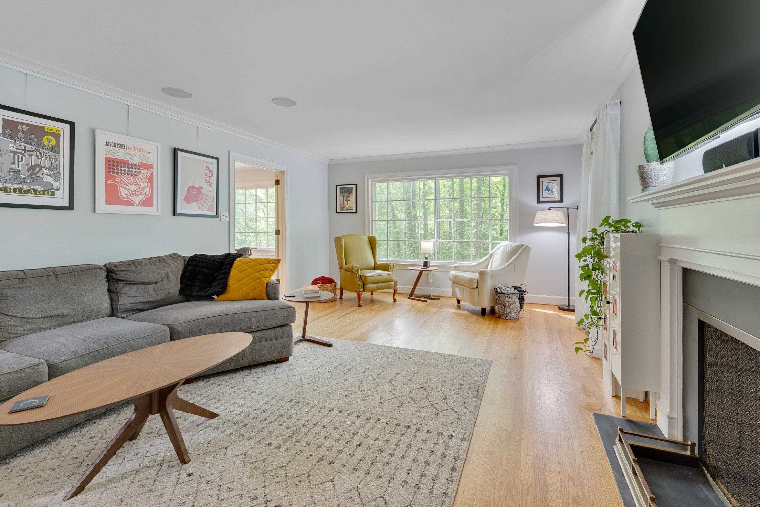 4216 Oak Park Road Raleigh, NC 27612 - Photo 3 of 14 Living Room Features an Oversized Picture Frame Window Living Room