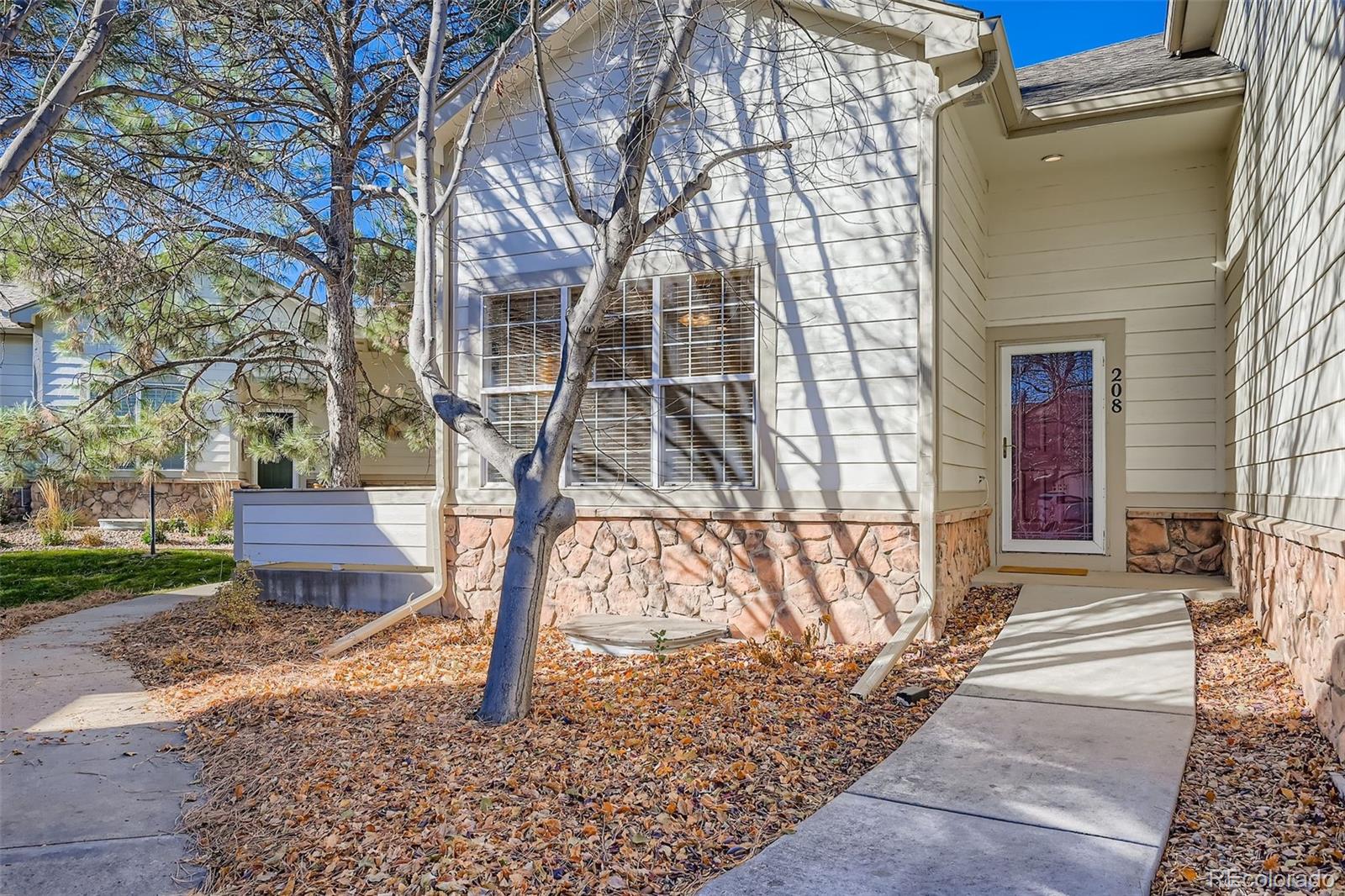208 Remuda Lane Lafayette, CO 80026 - Photo 2 of 28 a view of a backyard with a table and chair